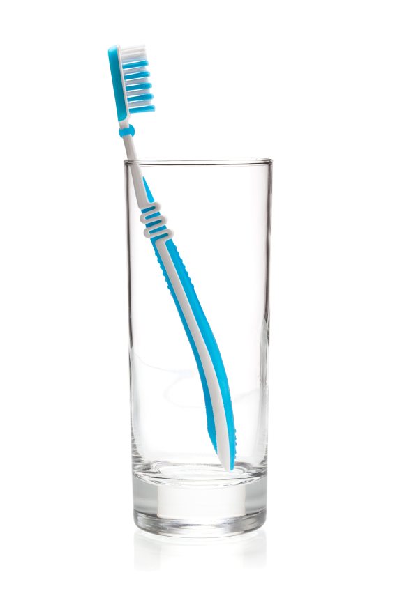 Blue tooth brush in glass